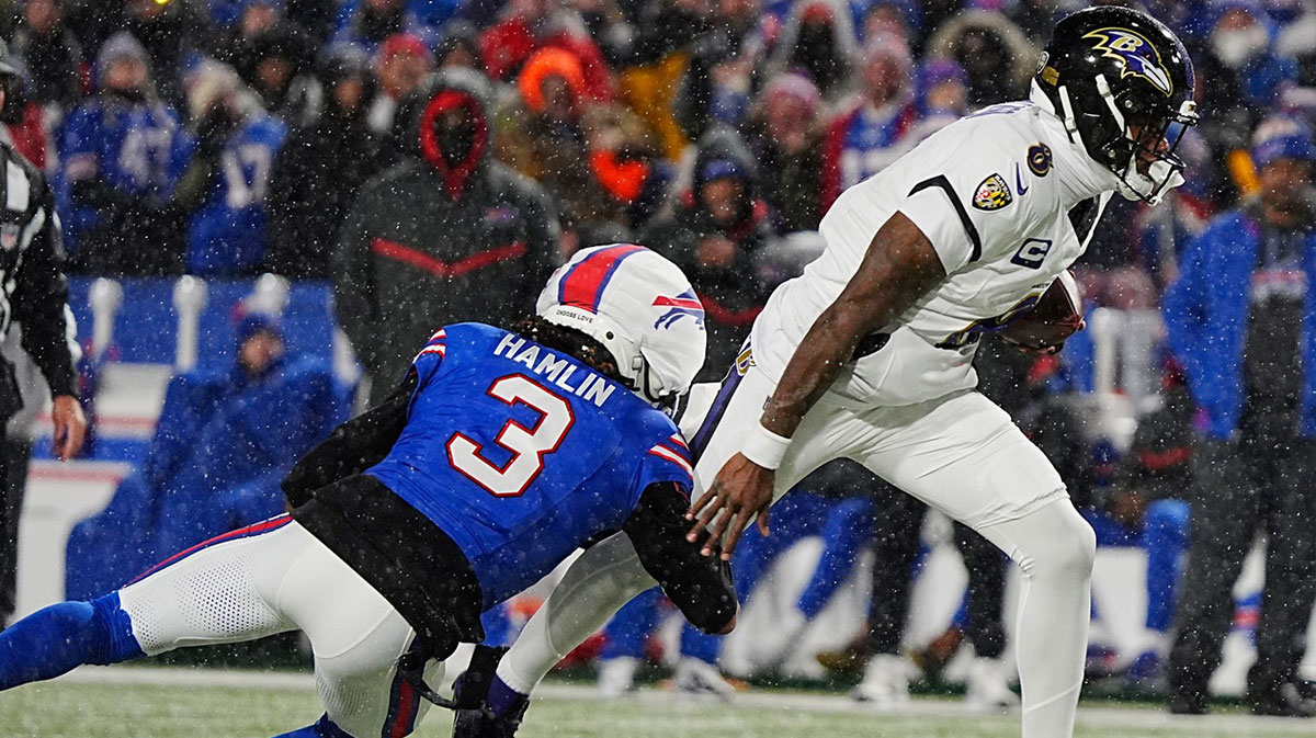 Buffalo Bills safety Damar Hamlin grabs a hold of Baltimore Ravens quarterback Lamar Jackson’s leg and sacks him causing a fumble that Bills Von Miller picked up and ran for about 39 yards with during first half action at the Buffalo Bills divisional game against the Baltimore Ravens at Highmark Stadium in Orchard Park on Jan. 19, 2025.