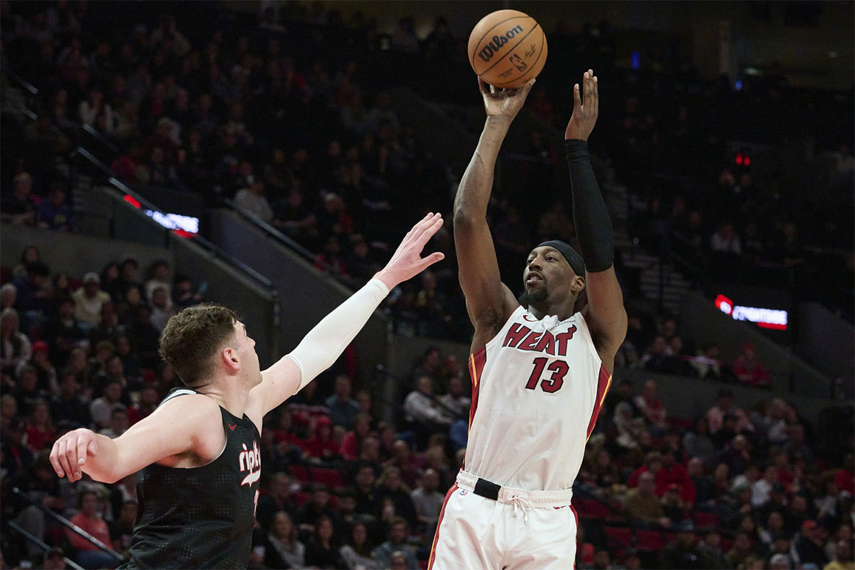 Miami Heat center Bam Adebayo (13) makes a jump shot in the second half against Portland Trail Blazers center Donovan Klingon (23) at the Moda Center. 