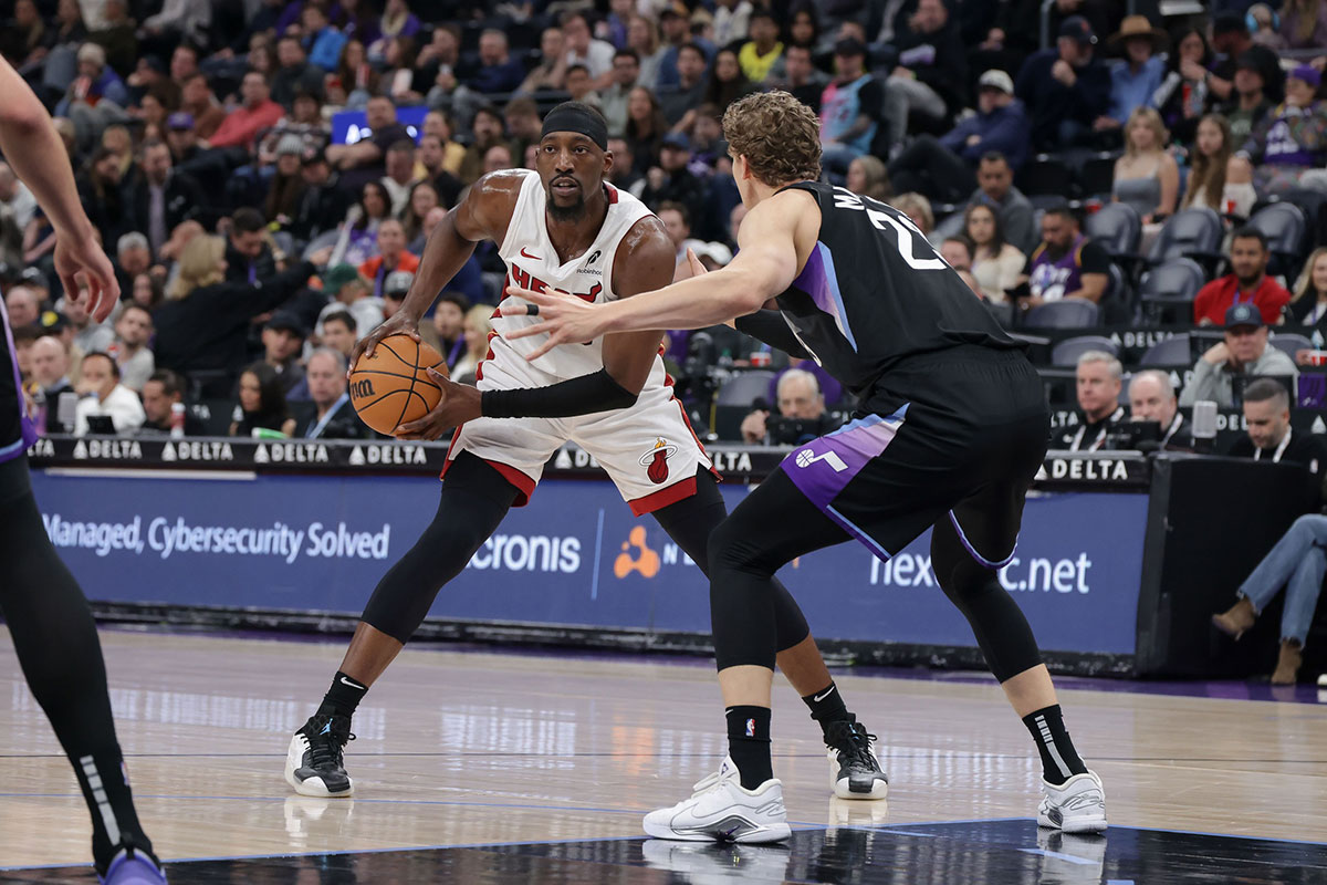 Miami Heat center Bam Adebayo (13) protects the ball from Utah Jazz forward Lauri Markkanen (23) during the first quarter at Delta Center.