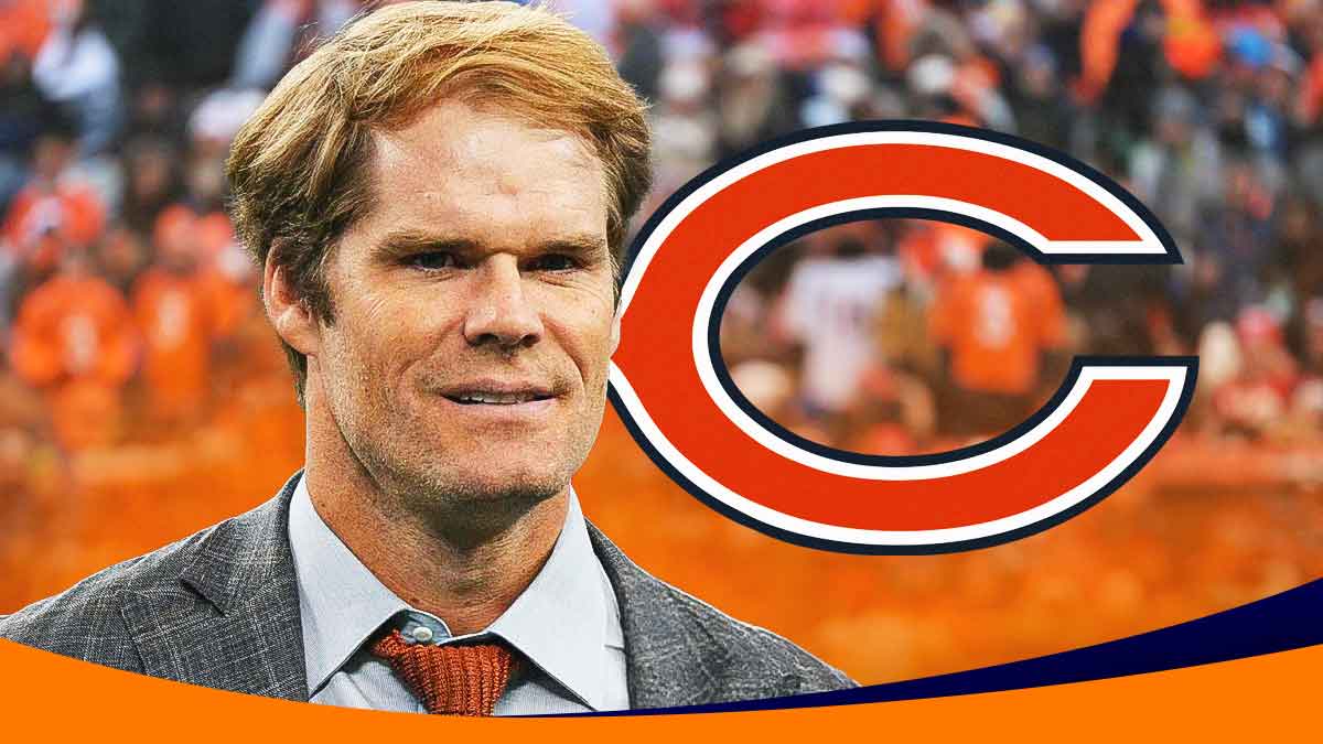 Greg Olsen in street clothes next to Bears logo