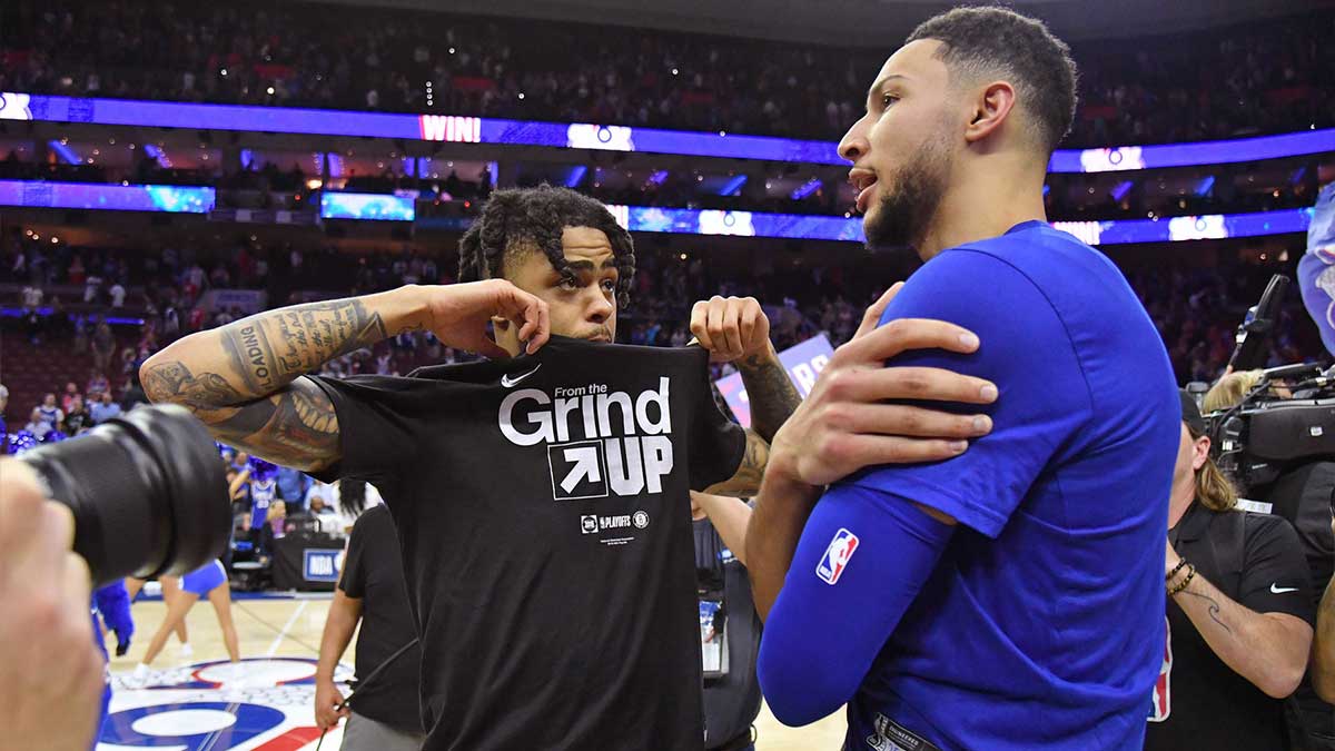 Brooklyn Nets guard D'Angelo Russell (1) and Philadelphia 76ers guard Ben Simmons (25) after 76ers win in game five of the first round of the 2019 NBA Playoffs at Wells Fargo Center.