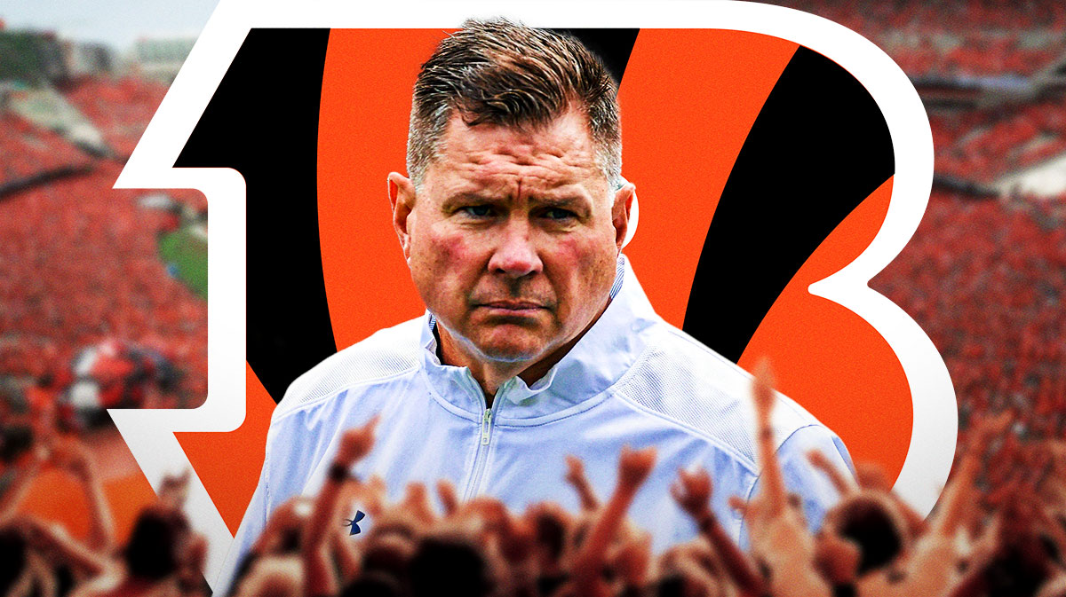 Notre Dame assistant coach Al Golden looking at the Bengals stadium, and the Bengals logo next to him