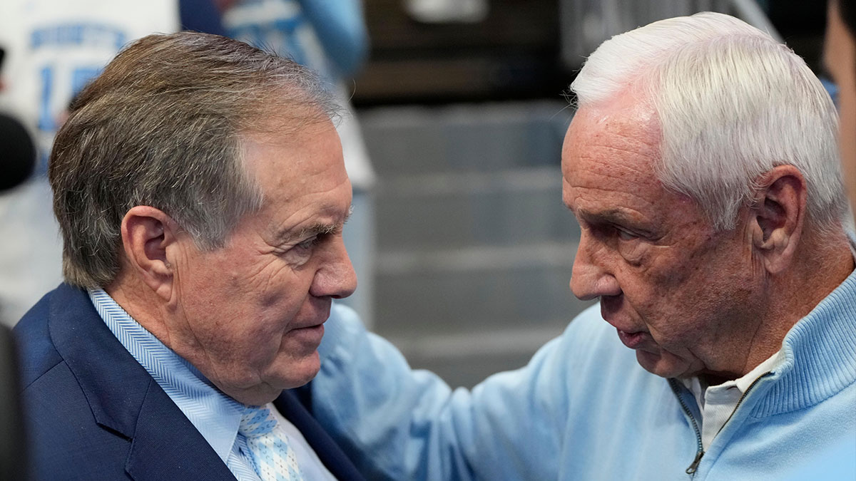Jan 18, 2025; Chapel Hill, North Carolina, USA; North Carolina Tar Heels head football coach Bill Belichick with former Tar Heels basketball coach Roy Williams before the game at Dean E. Smith Center. Mandatory Credit: Bob Donnan-Imagn Images