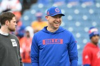 Buffalo Bills offensive coordinator Joe Brady watches warmups prior to a game against the Denver Broncos in an AFC wild card game at Highmark Stadium.