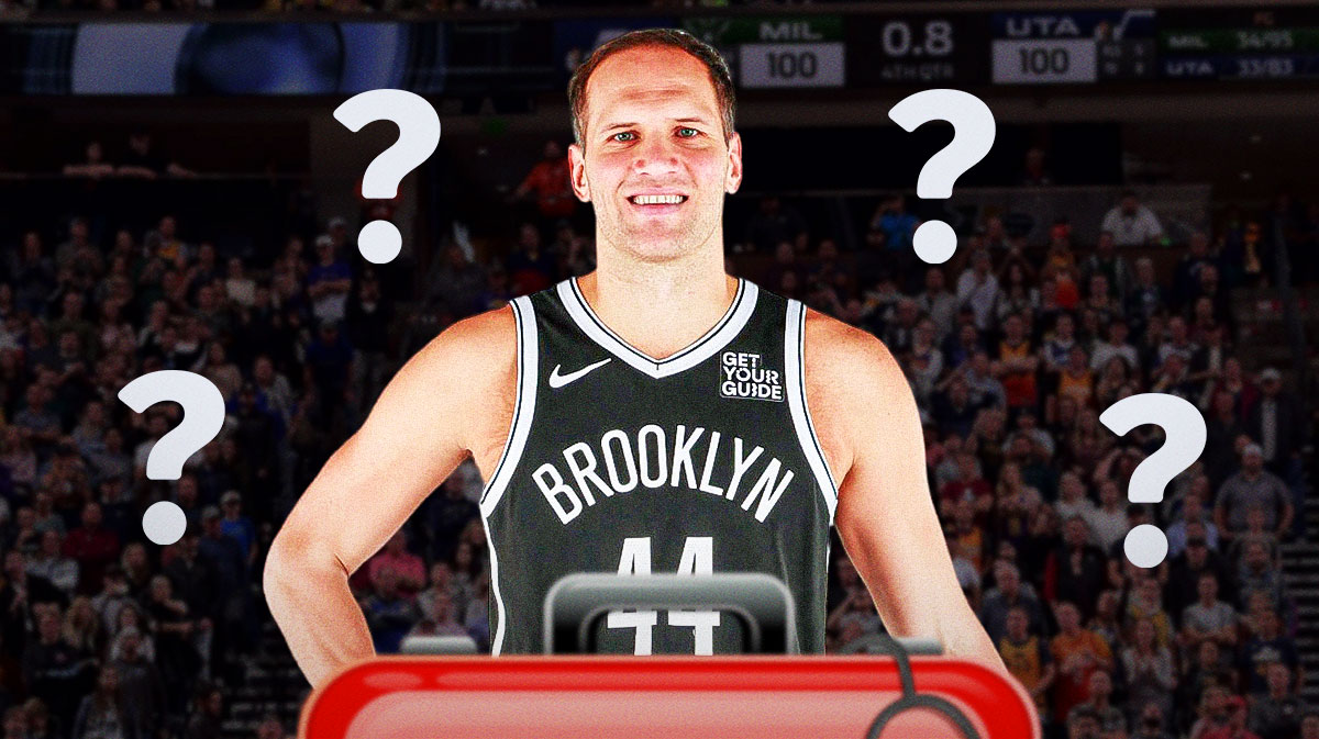 Bojan Bogdanovic in a Nets uniform with medical signs and question marks