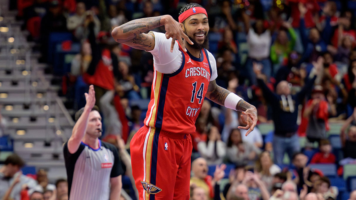 New Orleans Pelicans forward Brandon Ingram (14) celebrates a three point basket against the Denver Nuggets during the first half at Smoothie King Center.