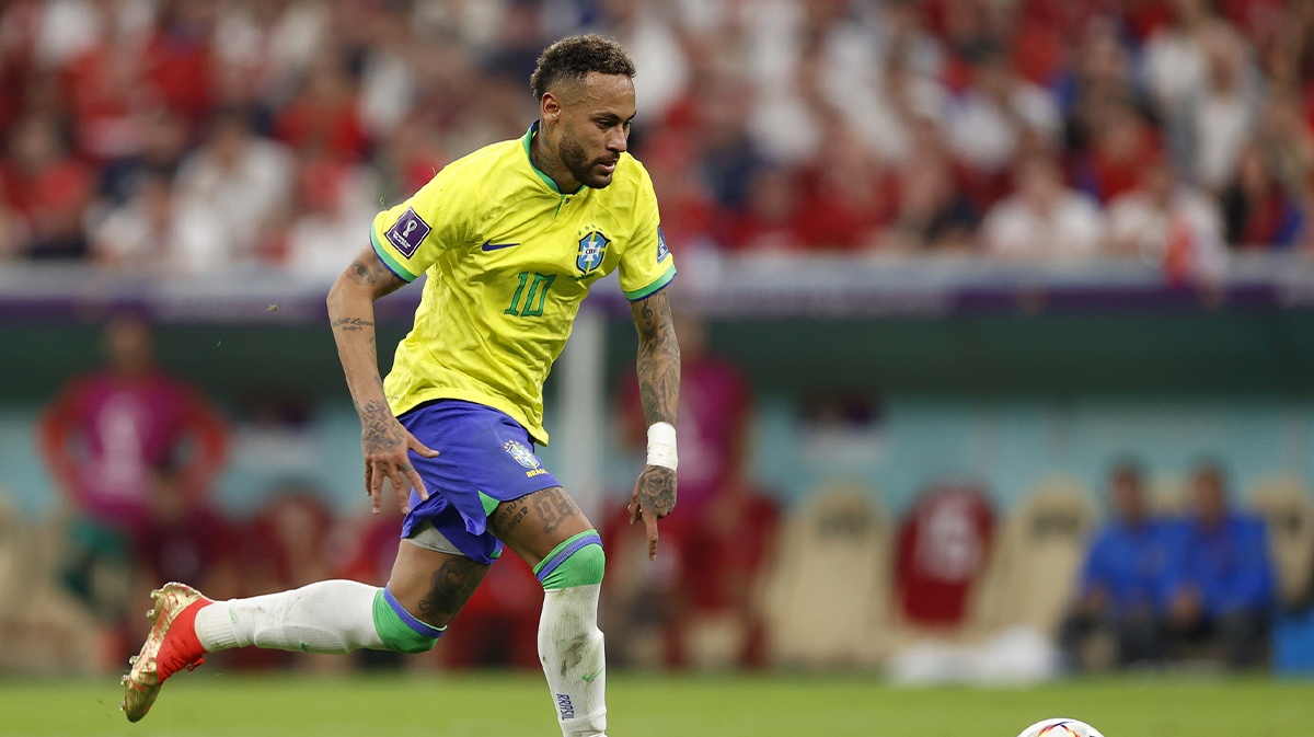 Brazil forward Neymar (10) kicks the ball against Serbia during the second half in a group stage match during the 2022 World Cup at Lusail Stadium.