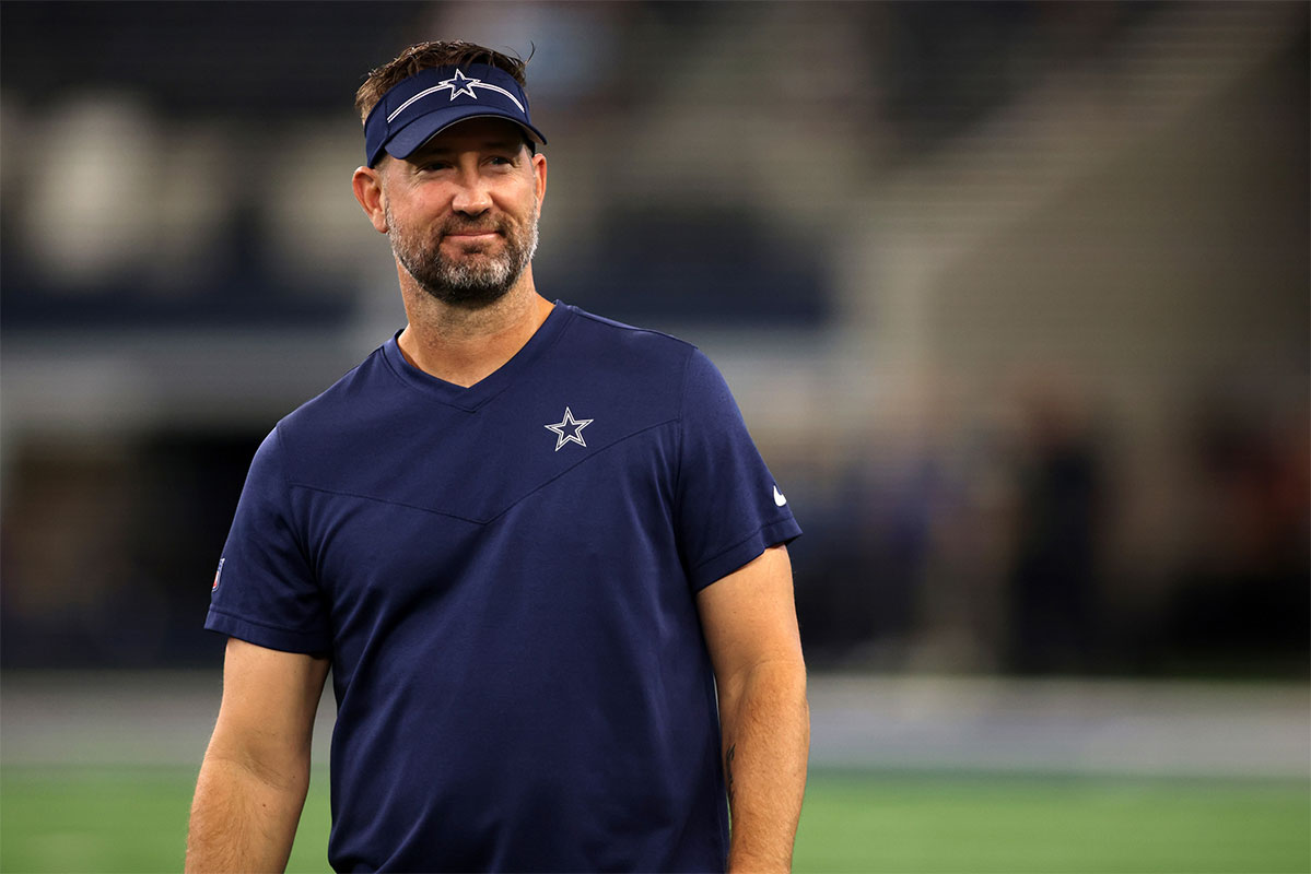 Dallas Cowboys offensive coordinator Brian Schottenheimer on the field before the game against the Las Vegas Raiders at AT&T Stadium.
