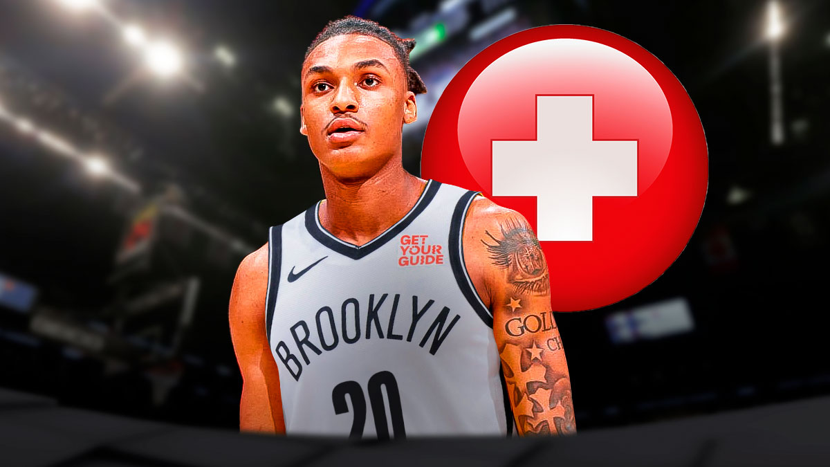Maxwell Lewis in a Nets uniform with medical signs around him
