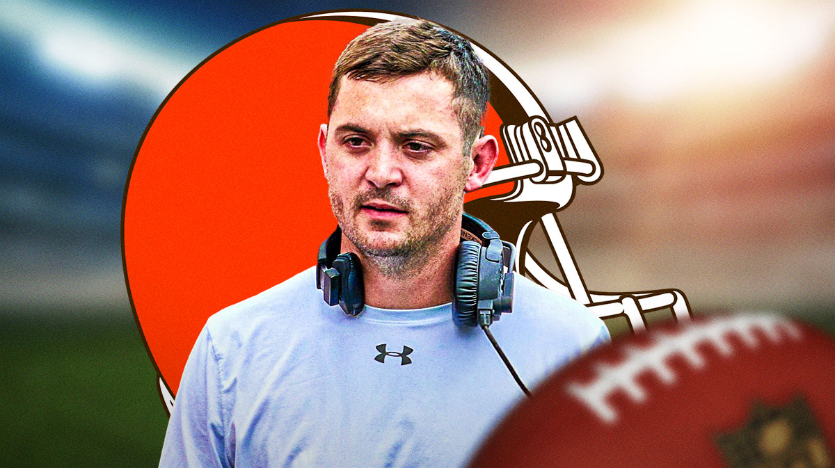 Cleveland Browns coach Tommy Rees with a logo for the Cleveland Browns.