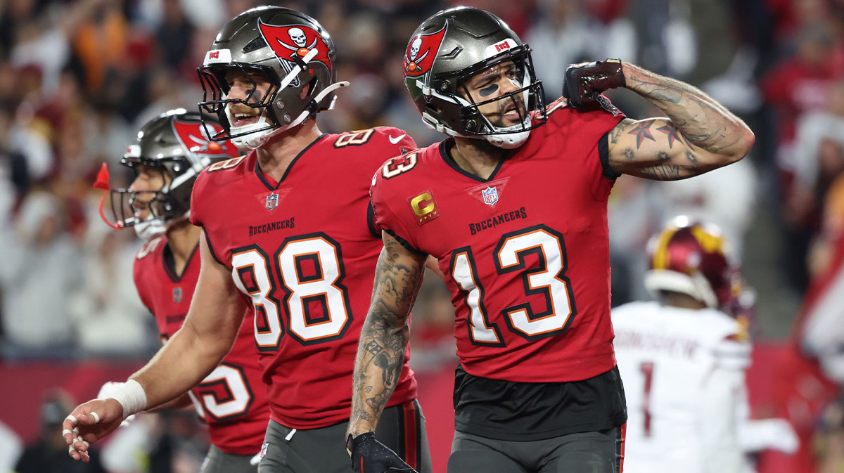 Tampa Bay Buccaneers wide receiver Mike Evans (13) celebrates after making a touchdown catch with Cade Otton (88) during the second quarter of the NFC wild card playoff game against the Washington Commanders at Raymond James Stadium.