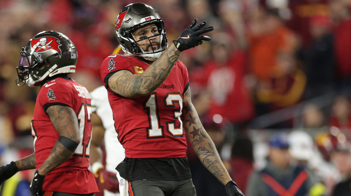 Buccaneers wide receiver Mike Evans (13) reacts after a first down