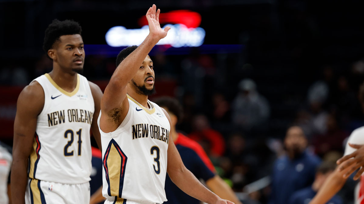 New Orleans Pelicans guard CJ McCollum (3) celebrates with teammates during a timeout against the Washington Wizards in the fourth quarter at Capital One Arena.