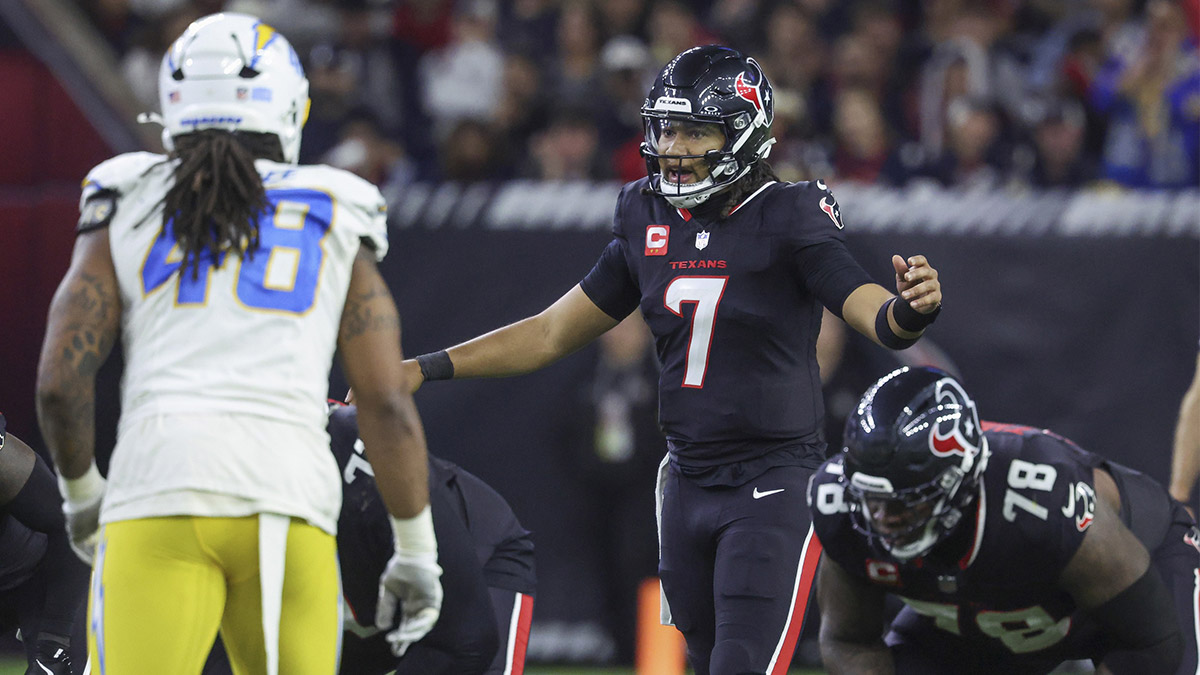 Jan 11, 2025; Houston, Texas, USA; Houston Texans quarterback C.J. Stroud (7) at the line of scrimmage during the game against the Los Angeles Chargers in an AFC wild card game at NRG Stadium.