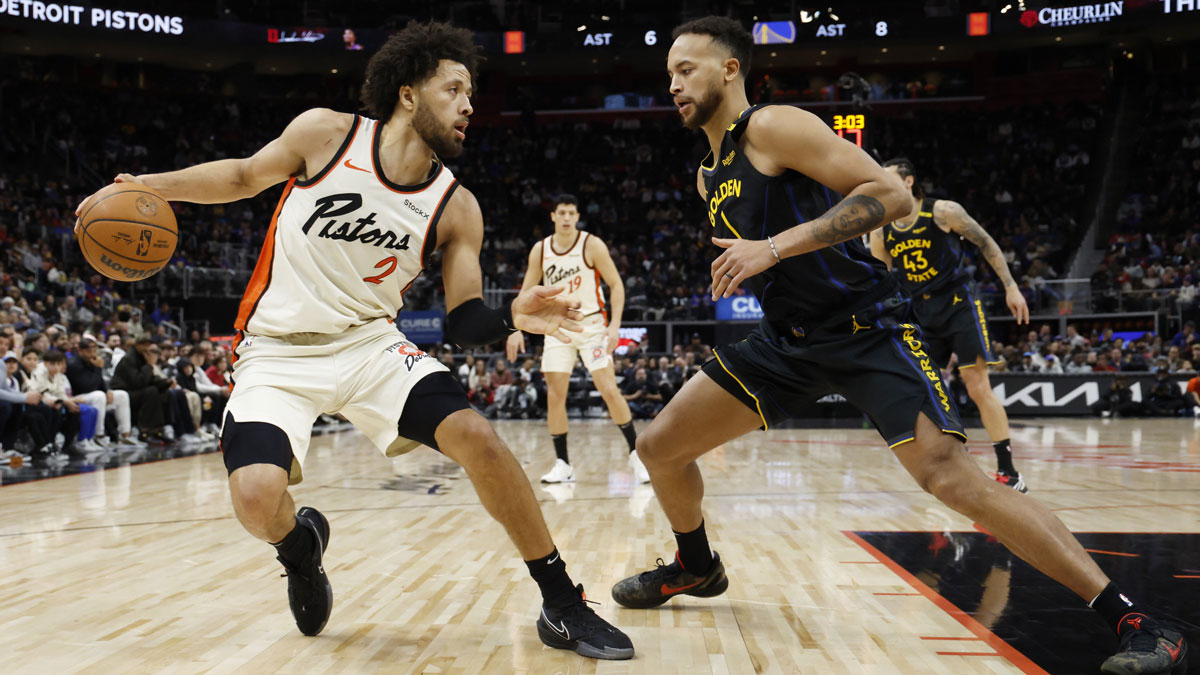 Detroit Pistons guard Cade Cunningham (2) rebound against Golden State Warriors forward Kyle Anderson (1) in the first half at Little Caesars Arena.