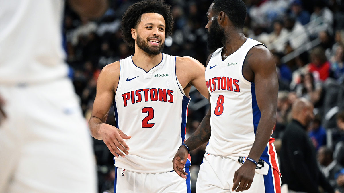 Detroit Pistons guard Cade Cunningham (2) and forward Tim Hardaway Jr. (8) begin to celebrate after Hardaway was fouled late in the fourth quarter against the Orlando Magic to help the Pistons to a victory at Little Caesars Arena.