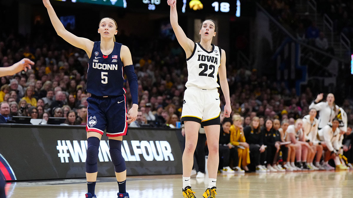 Iowa Hawkeyes guard Caitlin Clark (22) and Connecticut Huskies guard Paige Bueckers (5) react in the second quarter in the semifinals of the Final Four of the womens 2024 NCAA Tournament at Rocket Mortgage FieldHouse. 