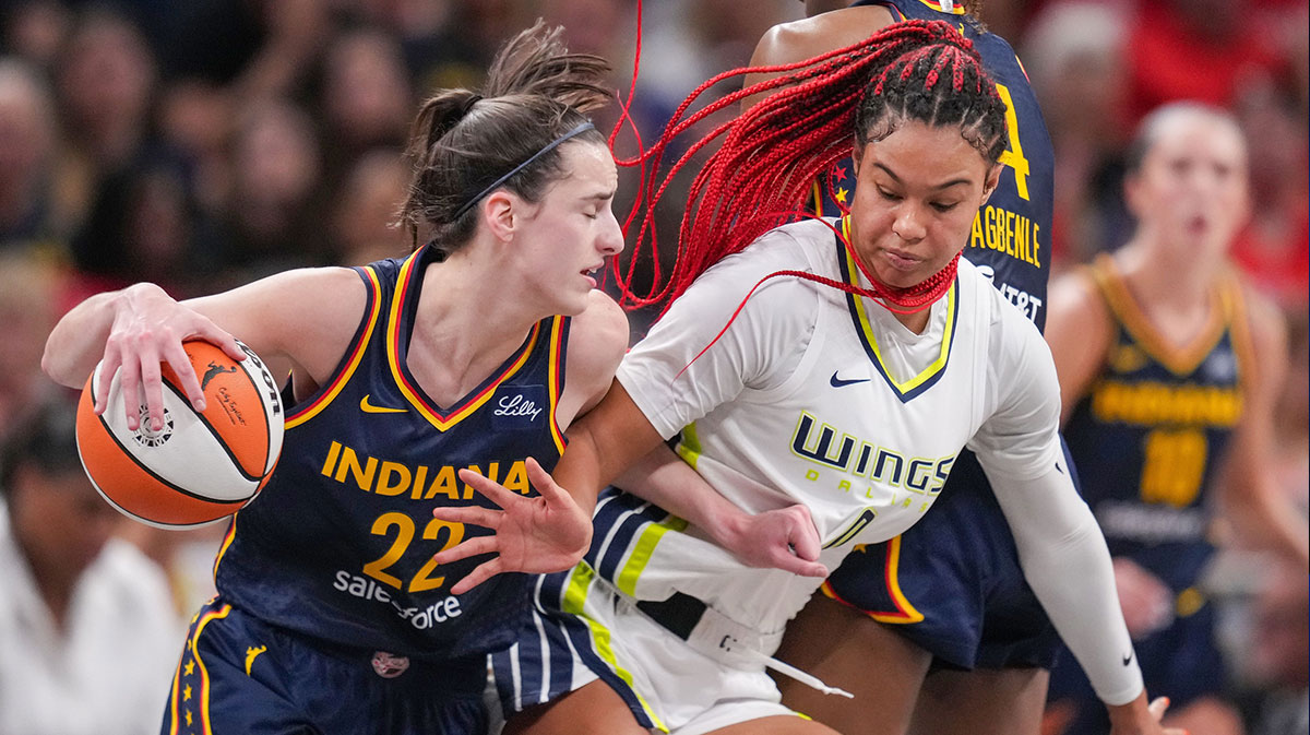 Indiana Fever guard Caitlin Clark (22) rushes up the court against Dallas Wings forward Satou Sabally (0) on Sunday, Sept. 15, 2024, during the game at Gainbridge Fieldhouse in Indianapolis. The Indiana Fever defeated the Dallas Wings, 110-109.