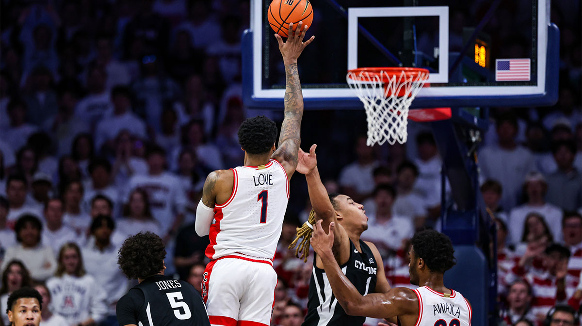 Arizona Wildcats guard Caleb Love (1) shoots the ball while Iowa State Cyclones center Dishon Jackson (1) fails to block him during the first half at McKale Center