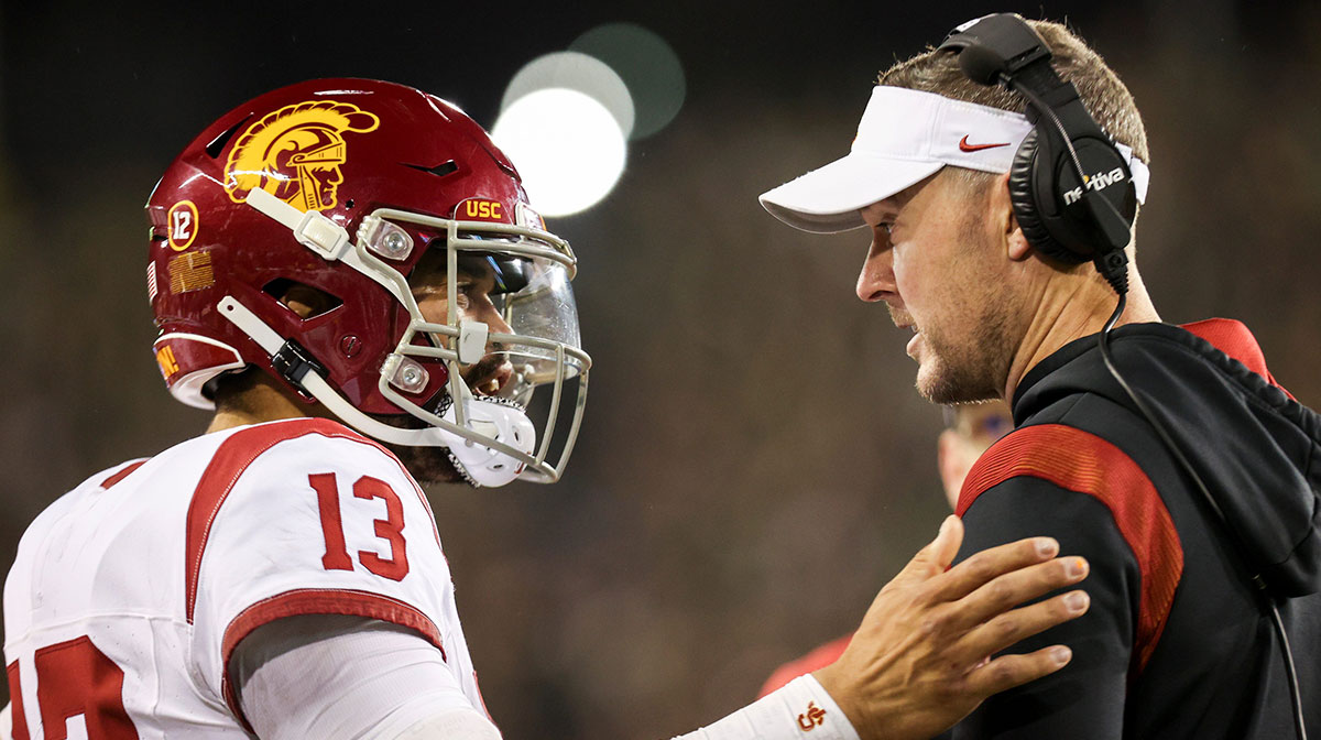 USC Trojans quarterback Caleb Williams talks with USC Trojans head coach Lincoln Riley during the first half of the game against No. 6 Oregon Ducks on Saturday, Nov. 11, 2023, at Autzen Stadium in Eugene, Ore.