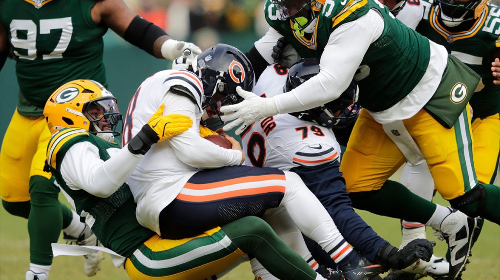 Green Bay Packers defensive end Rashan Gary (52) sacks Chicago Bears quarterback Caleb Williams (18) in the first quarter during their football game Sunday, January 5, 2025, at Lambeau Field in Green Bay, Wisconsin.