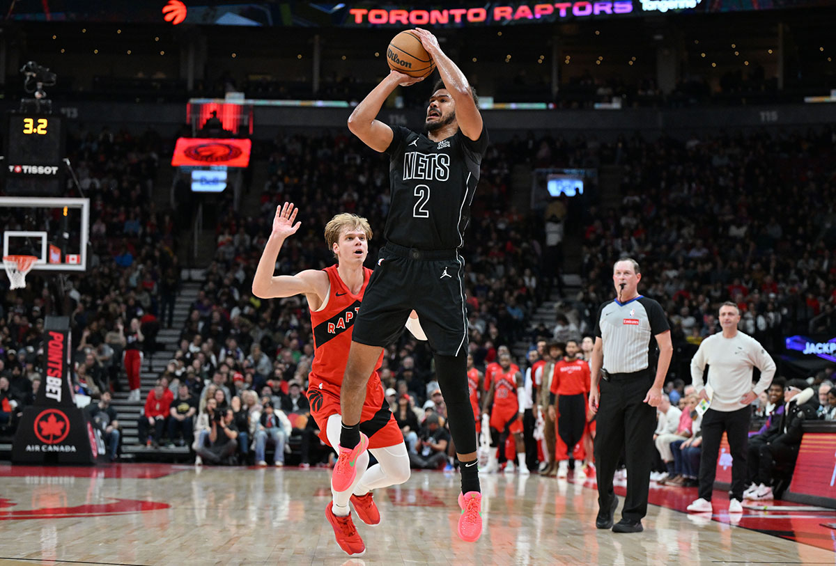 Brooklyn Nets forward Cam Johnson (2) shoots the ball over Toronto Raptors guard Grady Dick (1) in the first half at Scotiabank Arena.