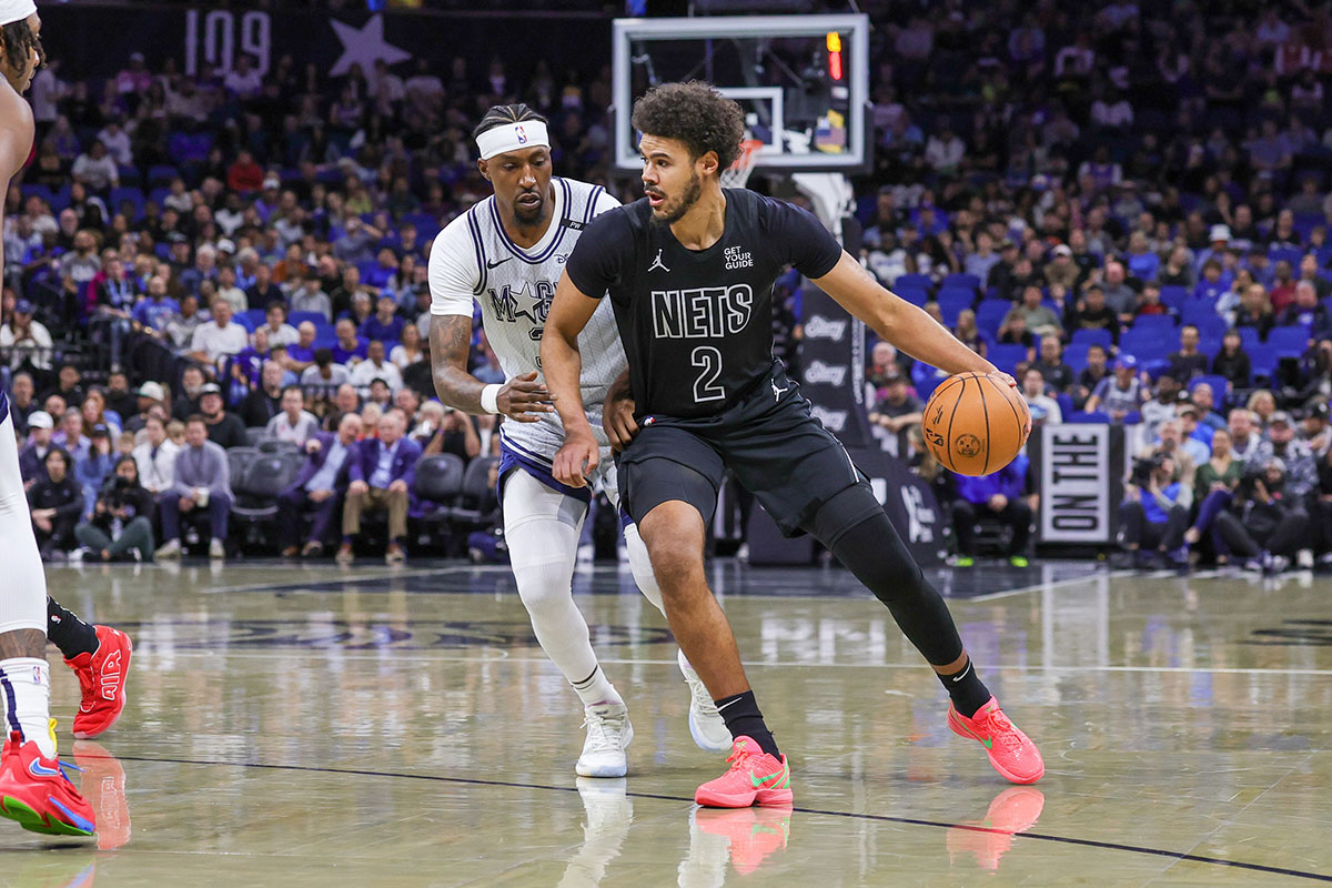 Dec 29, 2024; Orlando, Florida, USA; Brooklyn Nets forward Cameron Johnson (2) drives around Orlando Magic guard Kentavious Caldwell-Pope (3) during the first quarter at Kia Center. Mandatory Credit: Mike Watters-Imagn Images