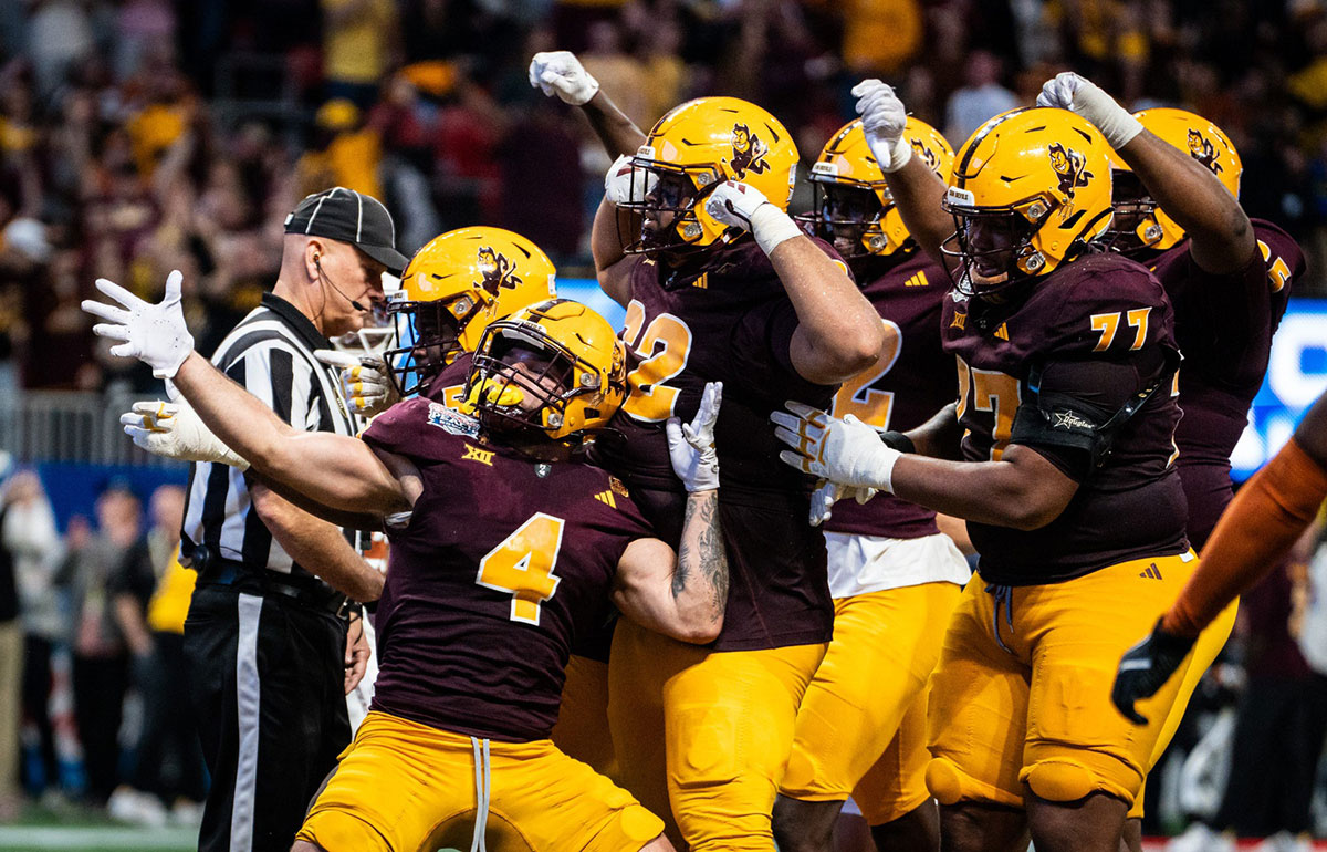 Arizona State football players celebrate together after Arizona State Sun Devils running back Cam Skattebo (4) scores a touchdown in the fourth quarter as the Texas Longhorns play the Arizona State Sun Devils in the Peach Bowl College Football Playoff quarterfinal at Mercedes-Benz Stadium in Atlanta, Georgia, Jan. 1, 2025.
