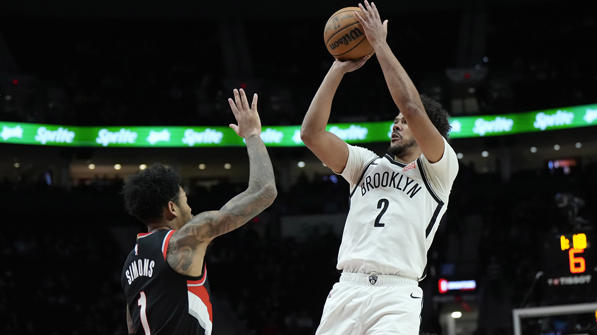 Brooklyn Networks Little forward Cameron Johnson (2) shoots the ball via Portland Trail Blazers Recording Guards Anfernee Simons (1) during the first half in the Fashion Center.