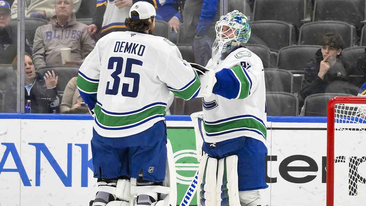 Vancouver Canucks Goaltender Kevin Lankinen (32) is celebrated with Goalsman Thatcher Demko (35) after CANECKS defeated at the Central Center St. Louis blues.