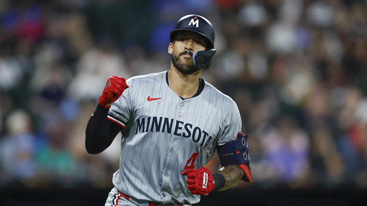 Minnesota Twins shortstop Carlos Correa (4) rounds the bases after hitting a solo home run against the Chicago White Sox during the seventh inning at Guaranteed Rate Field.