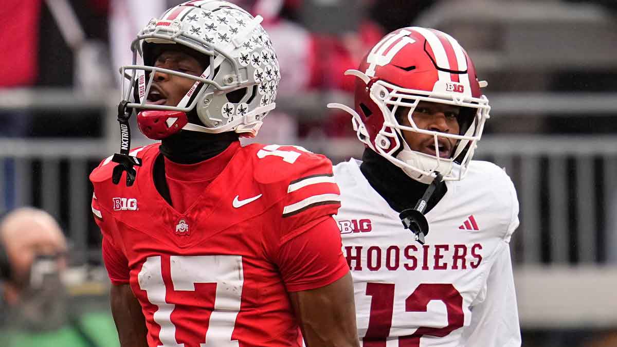 Ohio State Buckeyes wide receiver Carnell Tate (17) celebrates a first down catch beside Indiana Hoosiers defensive back Terry Jones Jr. (12) during the NCAA football game at Ohio Stadium in Columbus on Monday, Nov. 25, 2024. Ohio State won 38-15.