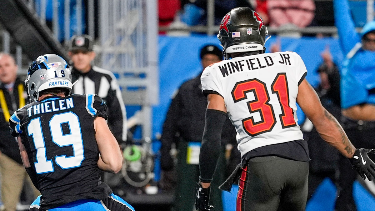 Carolina Panthers wide receiver Adam Thielen (19) makes a touchdown catch defended by Tampa Bay Buccaneers safety Antoine Winfield Jr. (31) during the second half at Bank of America Stadium