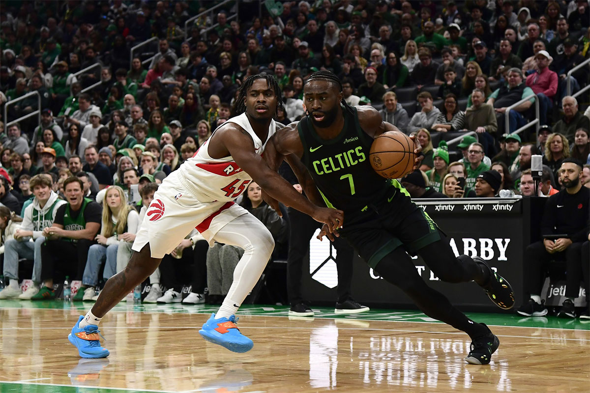 Celtics guard Jaylen Brown (7) drives to the basket while Toronto Raptors guard Davion Mitchell (45) defends during the first half at TD Garden