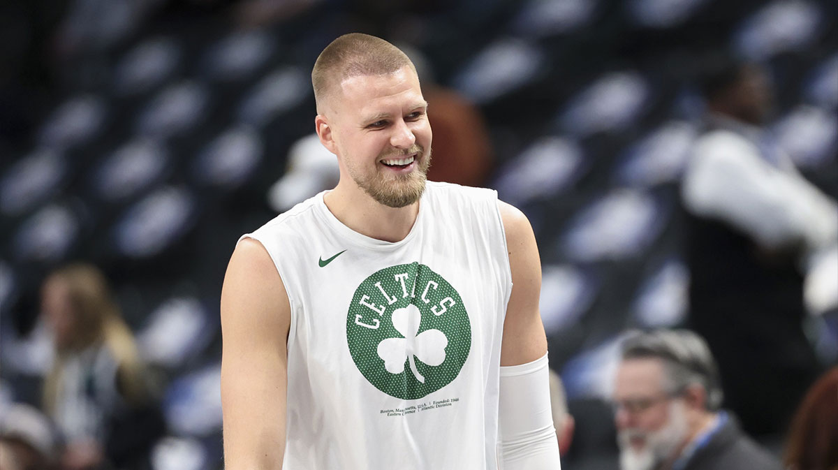 The center of Boston Seltiks KristaS Porzingis (8) laughs before the match against Dallas Maveriks in the American Airlines Center.