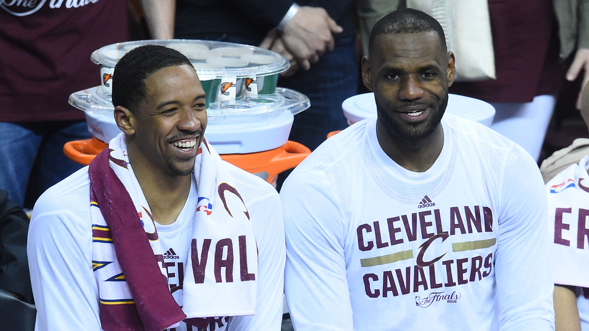 Cleveland Cavaliers forward Channing Frye (9), Richard Jefferson and forward LeBron James (23) smile from the bench during the final seconds of game three of the NBA Finals against the Golden State Warriors at Quicken Loans Arena. The Cavaliers won 120-90.