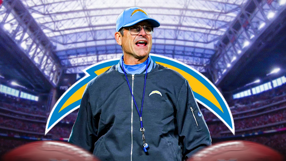 Chargers HC Jim Harbaugh, Texans' NRG Stadium behind him