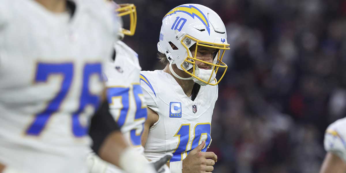 Los Angeles Chargers quarterback Justin Herbert (10) runs down the field during the AFC wild card game against the Houston Texans at NRG Stadium. Mandatory credit: Troy Taormina-Imagn Images