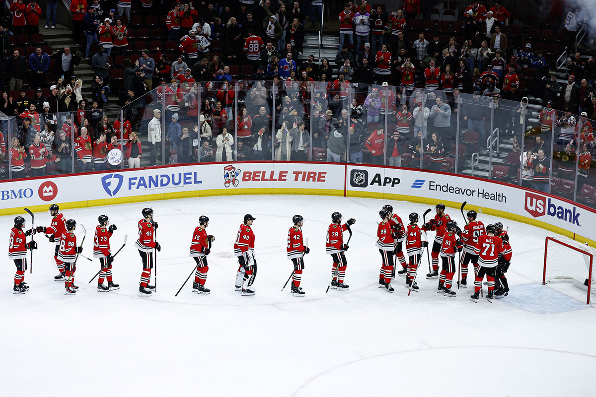 Chicago Blackhawks goaltender Petr Mrazek (34) celebrates with teammates after a win against the Colorado Avalanche at United Center.