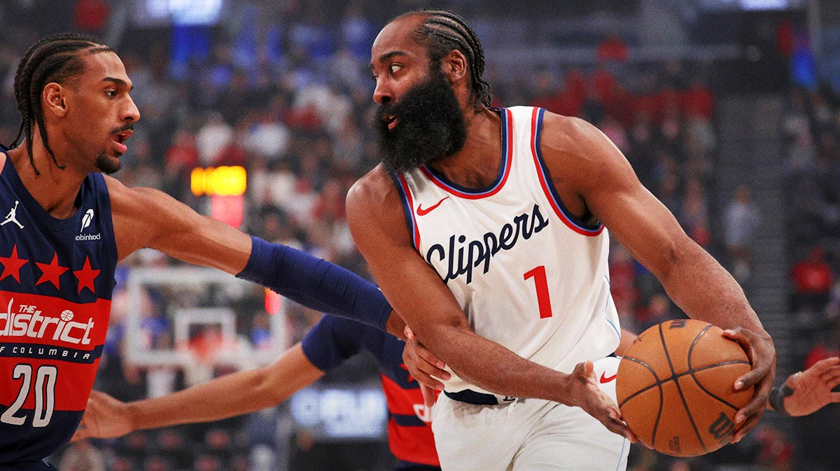 Clippers guard James Harden (1) is defended by Washington Wizards forward Alex Sarr (20) during the first quarter at Intuit Dome