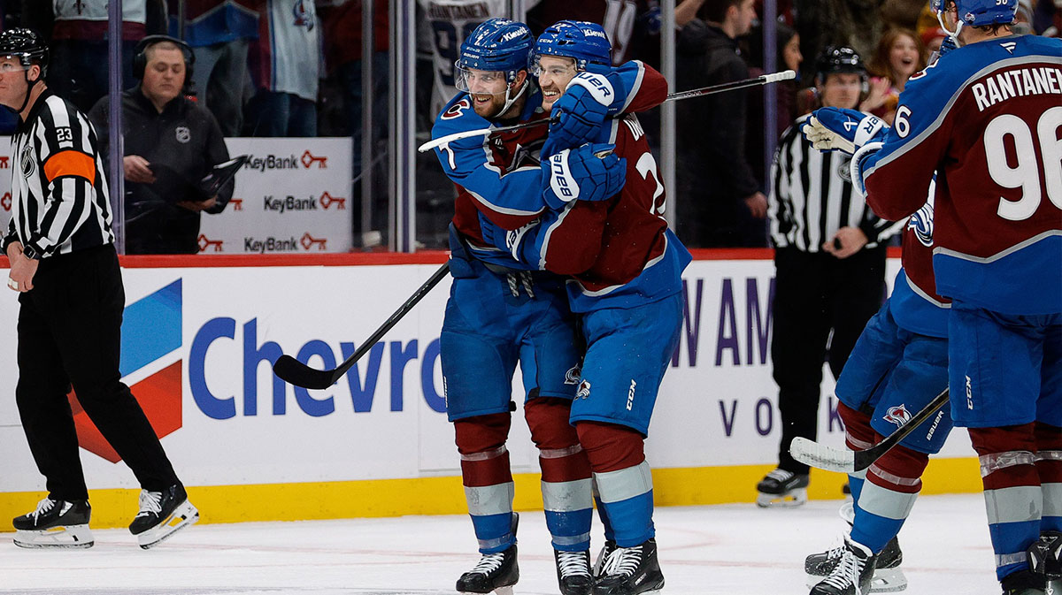 Colorado Avalanche defenseman Devon Toews (7) and left wing Jonathan Drouin (27) celebrate after the game against the Buffalo Sabres at Ball Arena.