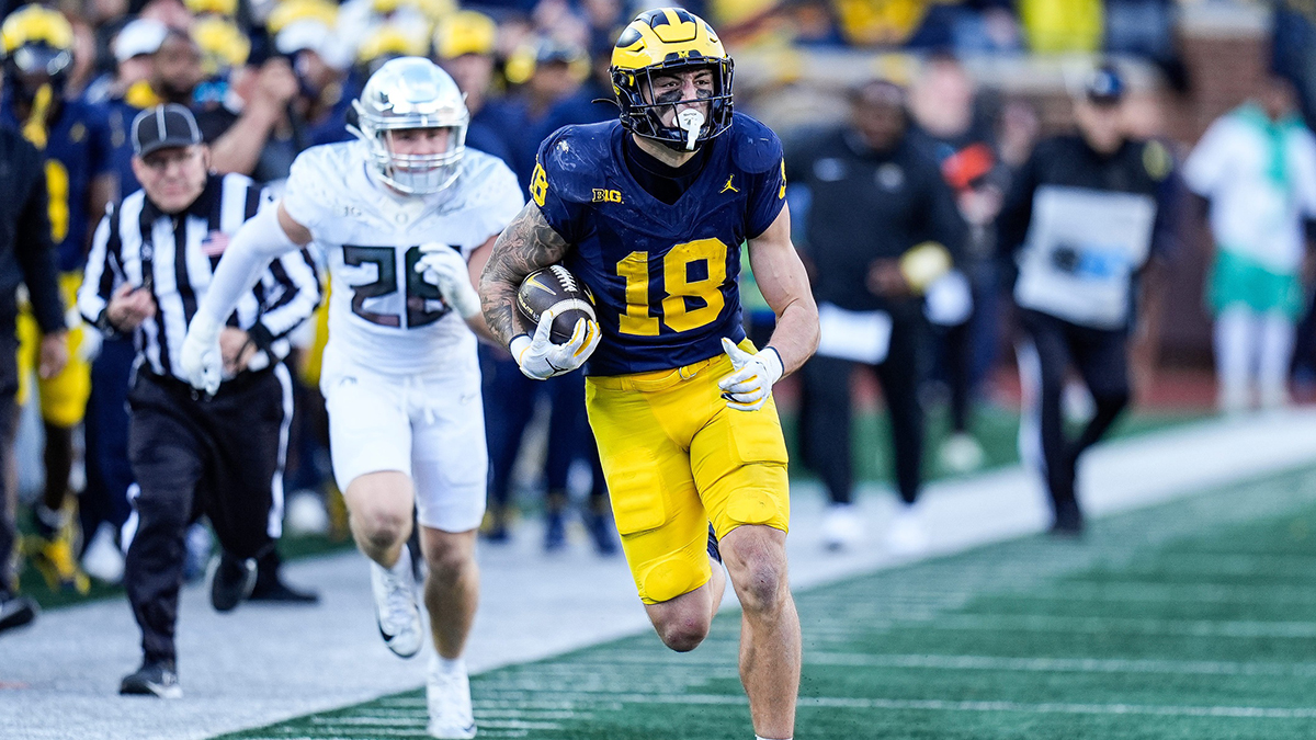 Michigan tight end Colston Loveland (18) runs against Oregon linebacker Bryce Boettcher (28) during the first half at Michigan Stadium in Ann Arbor on Saturday, Nov. 2, 2024.