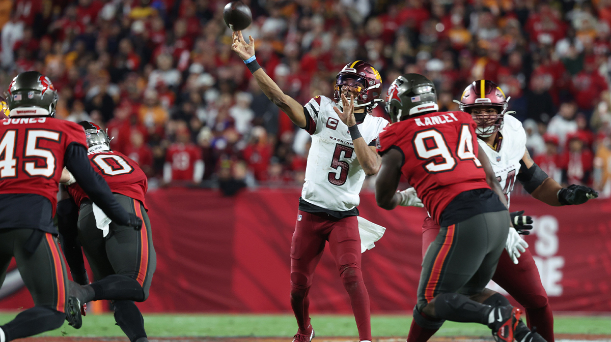 Washington Commanders quarterback Jayden Daniels (5) throws in the fourth quarter of the NFC wild card playoffs against the Tampa Bay Buccaneers at Raymond James Stadium. 