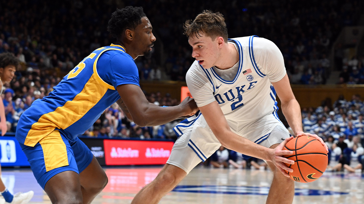Download Image Add To Lightbox Print Preview Headline: NCAA Basketball: Pittsburgh at Duke Caption: Jan 7, 2025; Durham, North Carolina, USA; Duke Blue Devils forward Cooper Flagg (2) controls the ball in front of Pitt Panthers forward Zack Austin (55) during the second half at Cameron Indoor Stadium.
