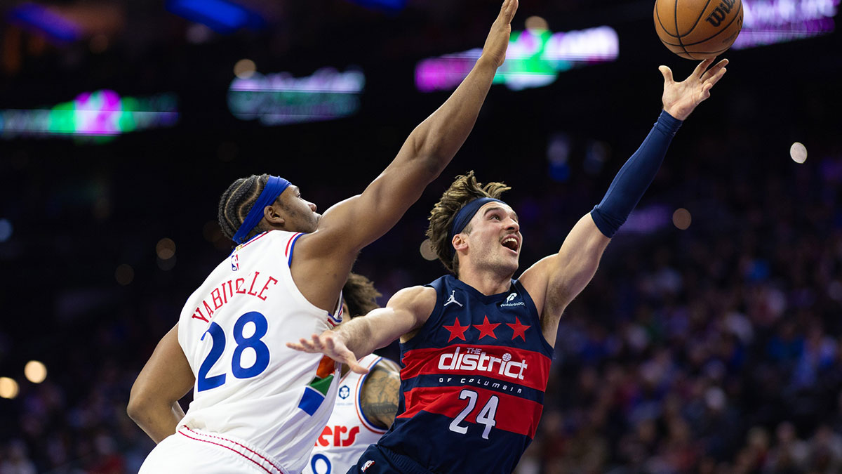 Washington Wizards forward Corey Kispert (24) drives for a shot past Philadelphia 76ers forward Guerschon Yabusele (28)during the second quarter at Wells Fargo Center.