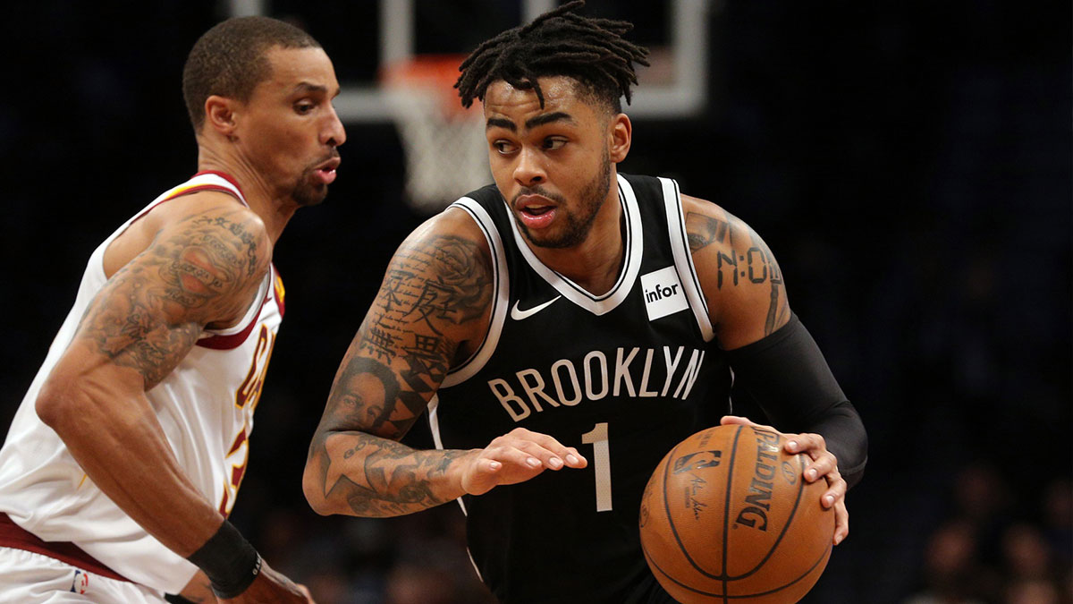 Brooklyn Nets point guard D'Angelo Russell (1) drives around Cleveland Cavaliers point guard George Hill (3) during the third quarter at Barclays Center.