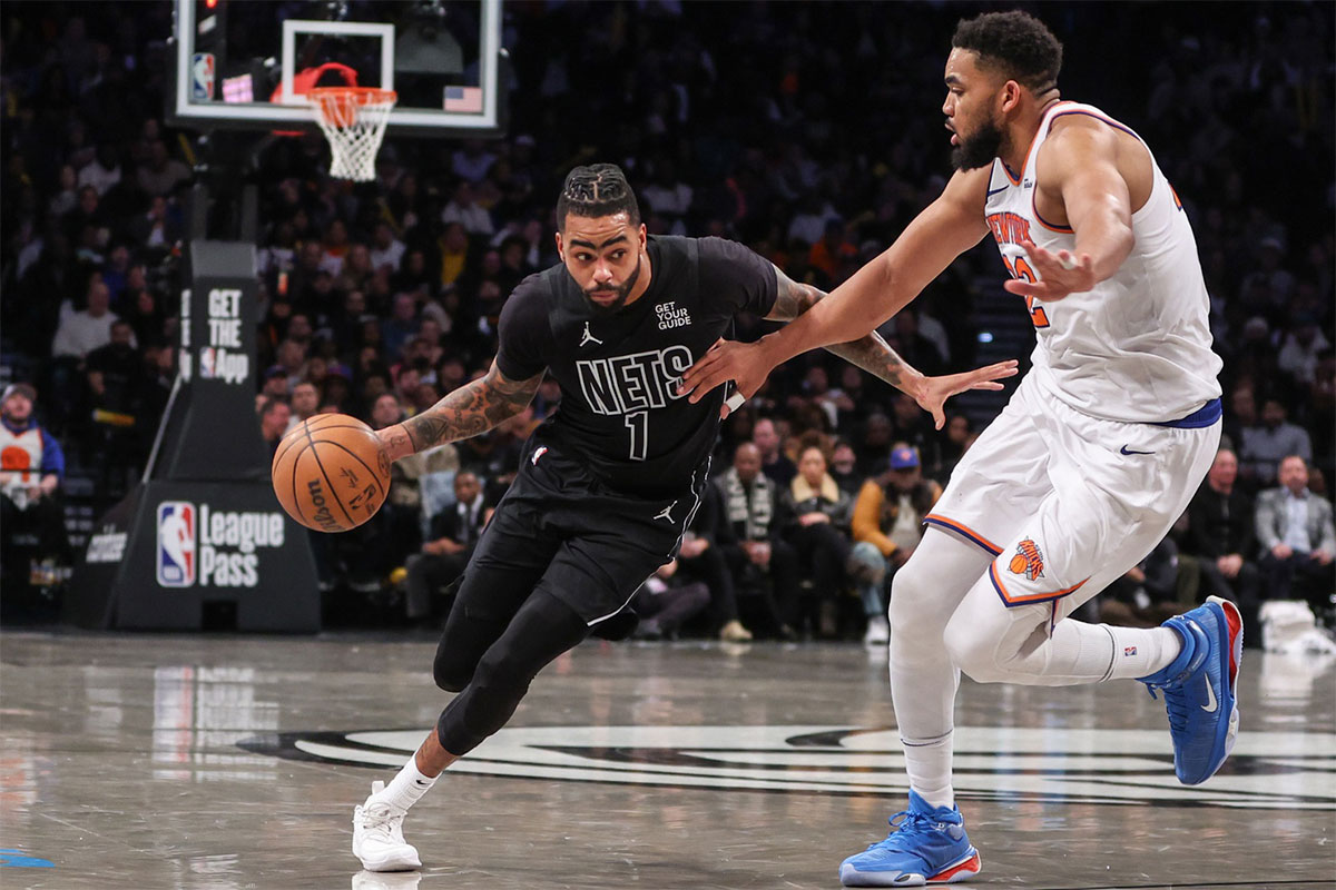 Brooklyn Nets guard D'Angelo Russell (1) drives past New York Knicks center Karl-Anthony Towns (32) in the third quarter at Barclays Center.