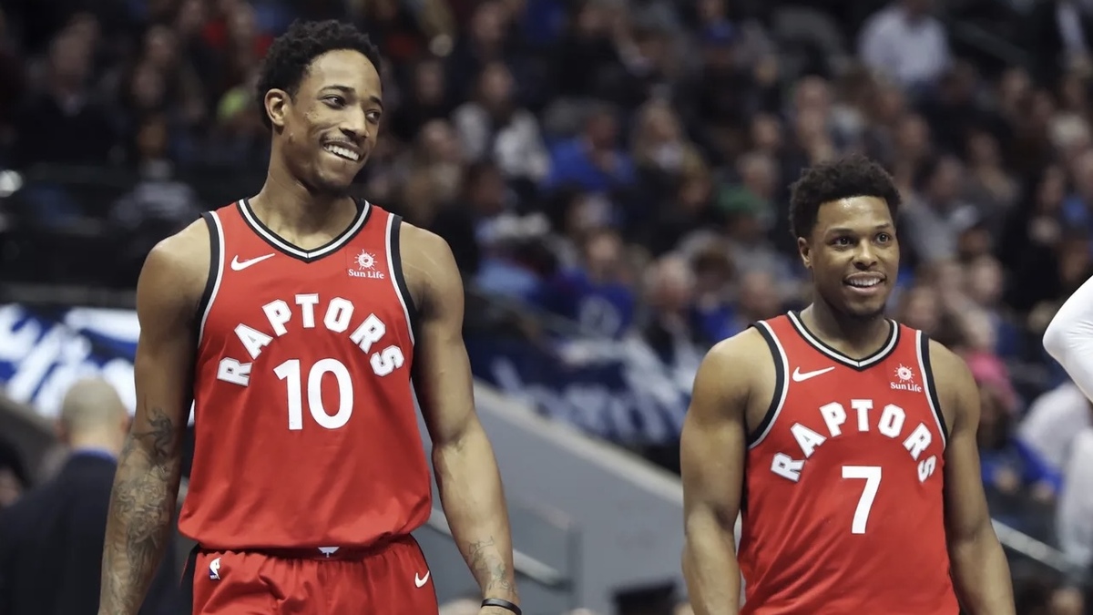 Toronto Raptors guard DeMar DeRozan (10) and guard Kyle Lowry (7) laugh during the first half against the Dallas Mavericks at American Airlines Center.