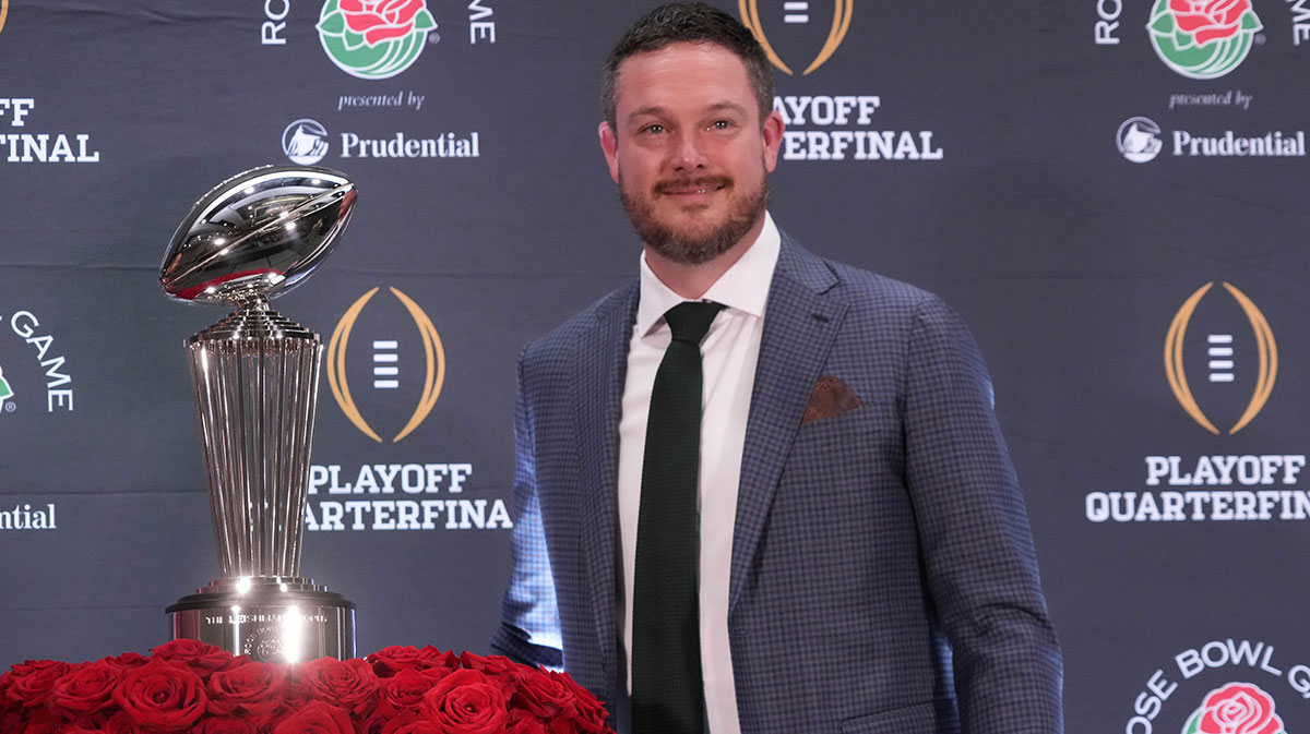 Oregon Ducks head coach Dan Lanning poses with the Leishman Trophy during the Rose Bowl head coaches press conference at Sheraton Grand LA.