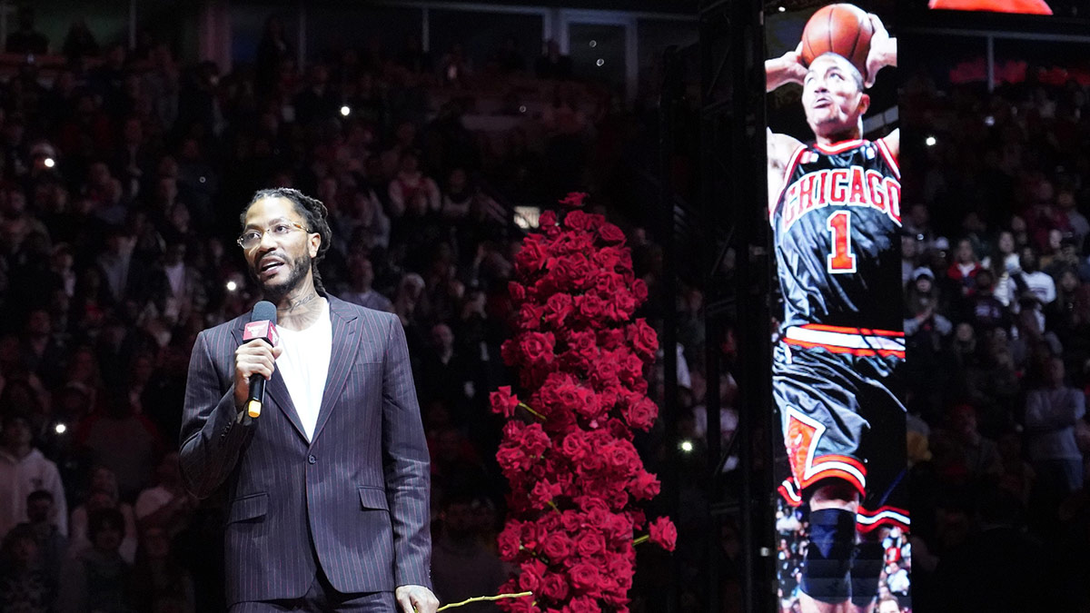 Chicago Bulls and New York Knicks former player Derrick Rose speaks as he is honored at halftime of a game between the Chicago Bulls and the New York Knicks at United Center.